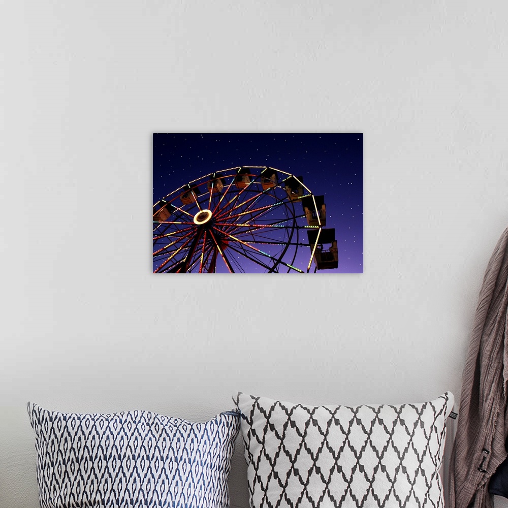 A bohemian room featuring Carnival ferris wheel against starry night sky.
