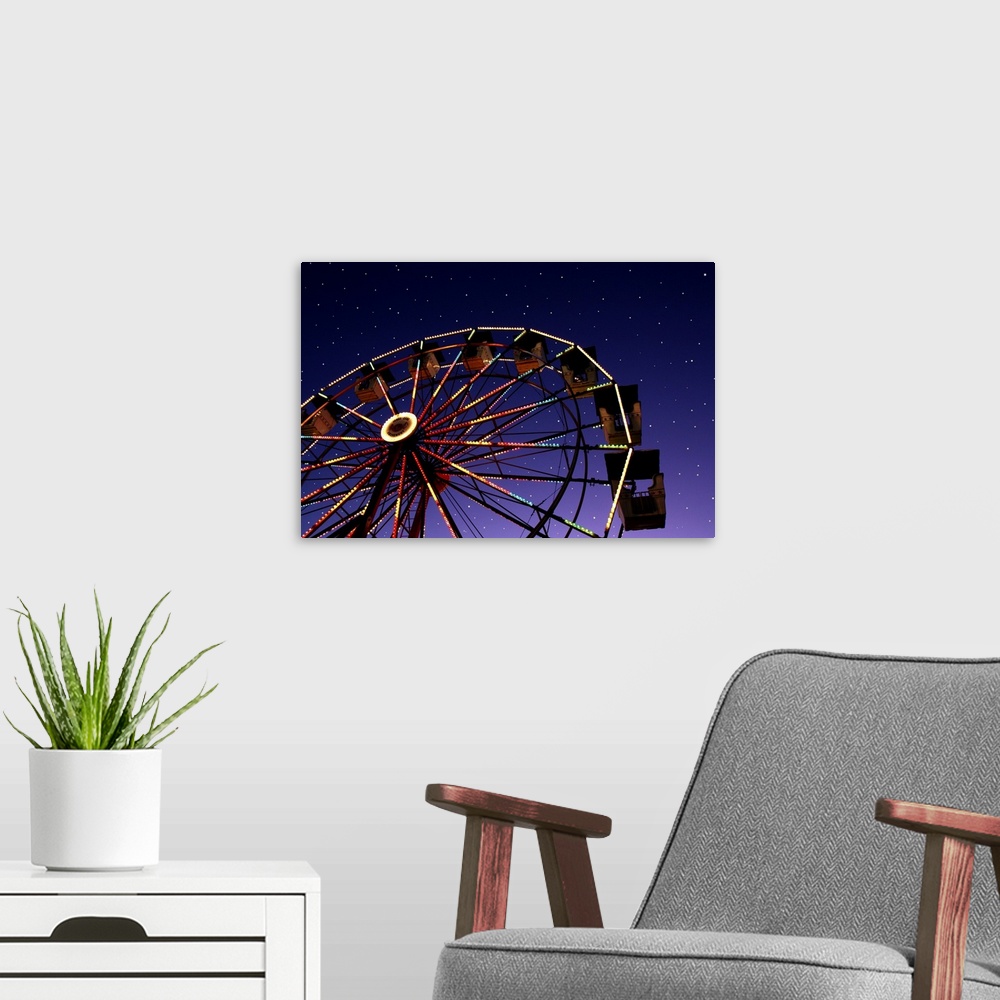 A modern room featuring Carnival ferris wheel against starry night sky.