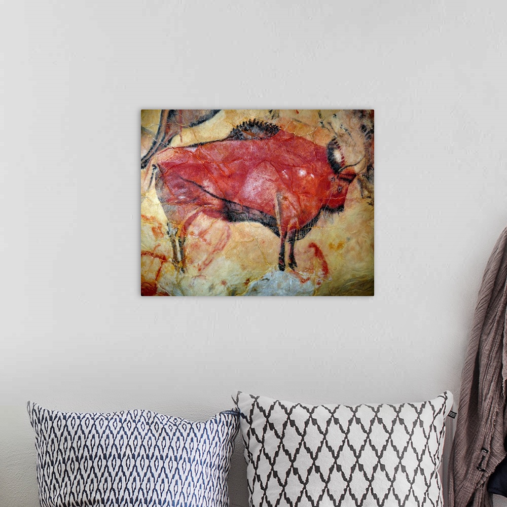 A bohemian room featuring Painting of a bison in the cave of Altamira, Spain.