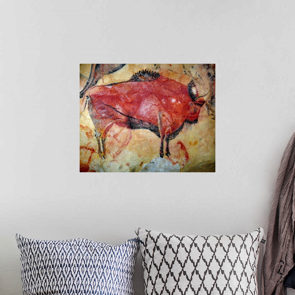A bohemian room featuring Painting of a bison in the cave of Altamira, Spain.