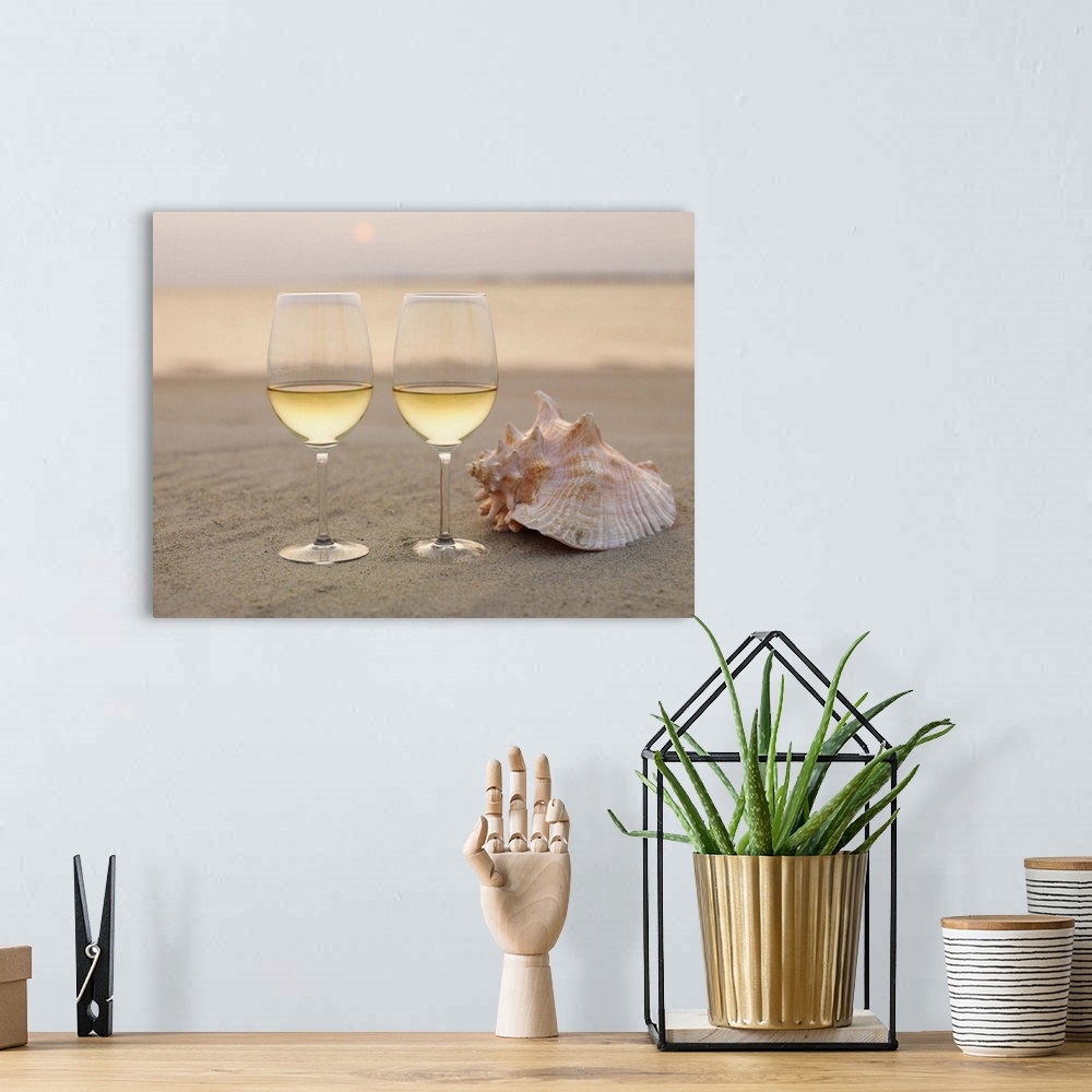 A bohemian room featuring Champagne glasses and shell on beach