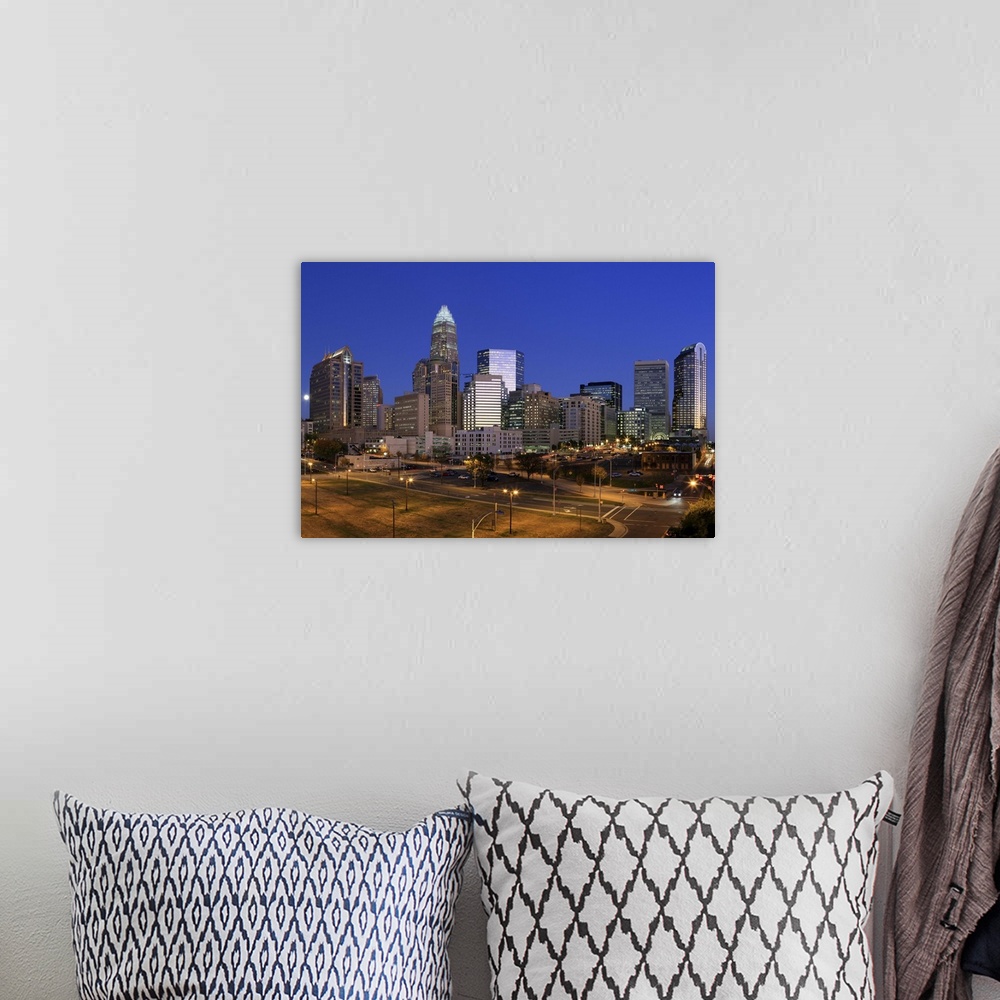A bohemian room featuring Downtown Charlotte, North Carolina skyline at night