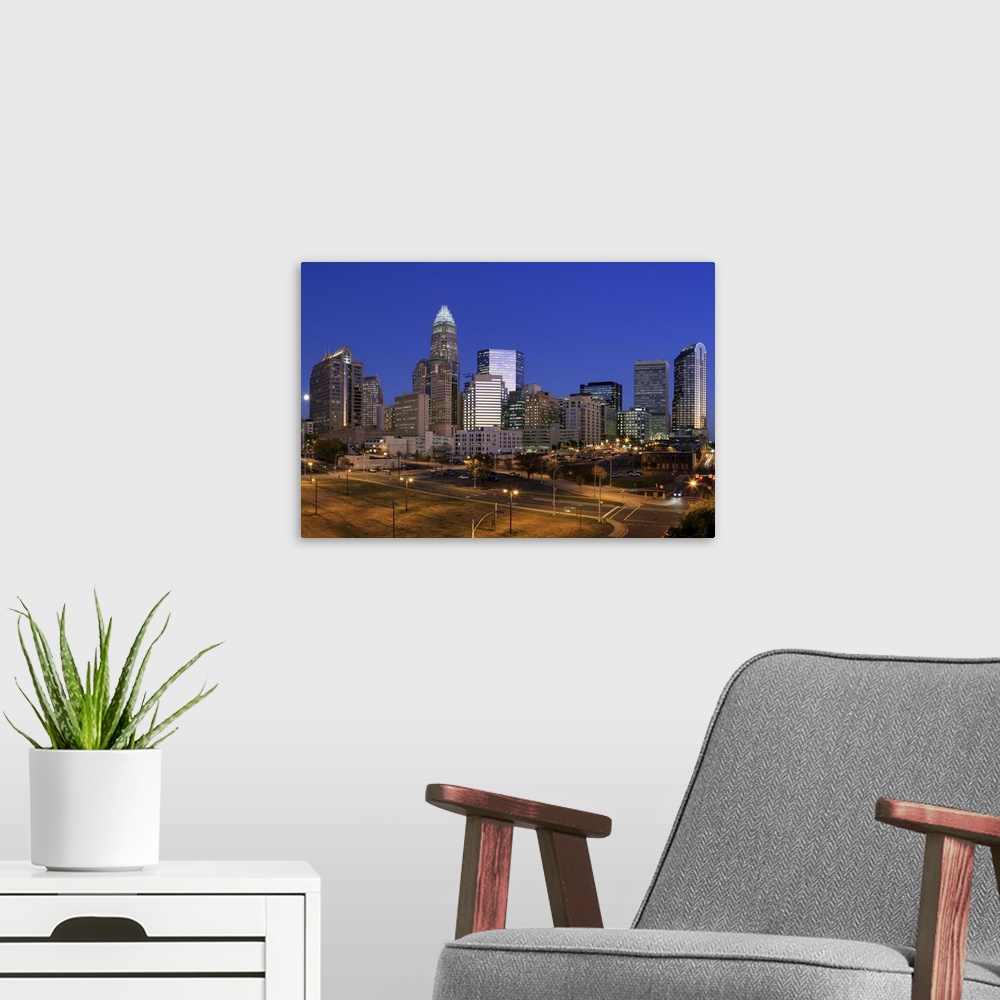 A modern room featuring Downtown Charlotte, North Carolina skyline at night