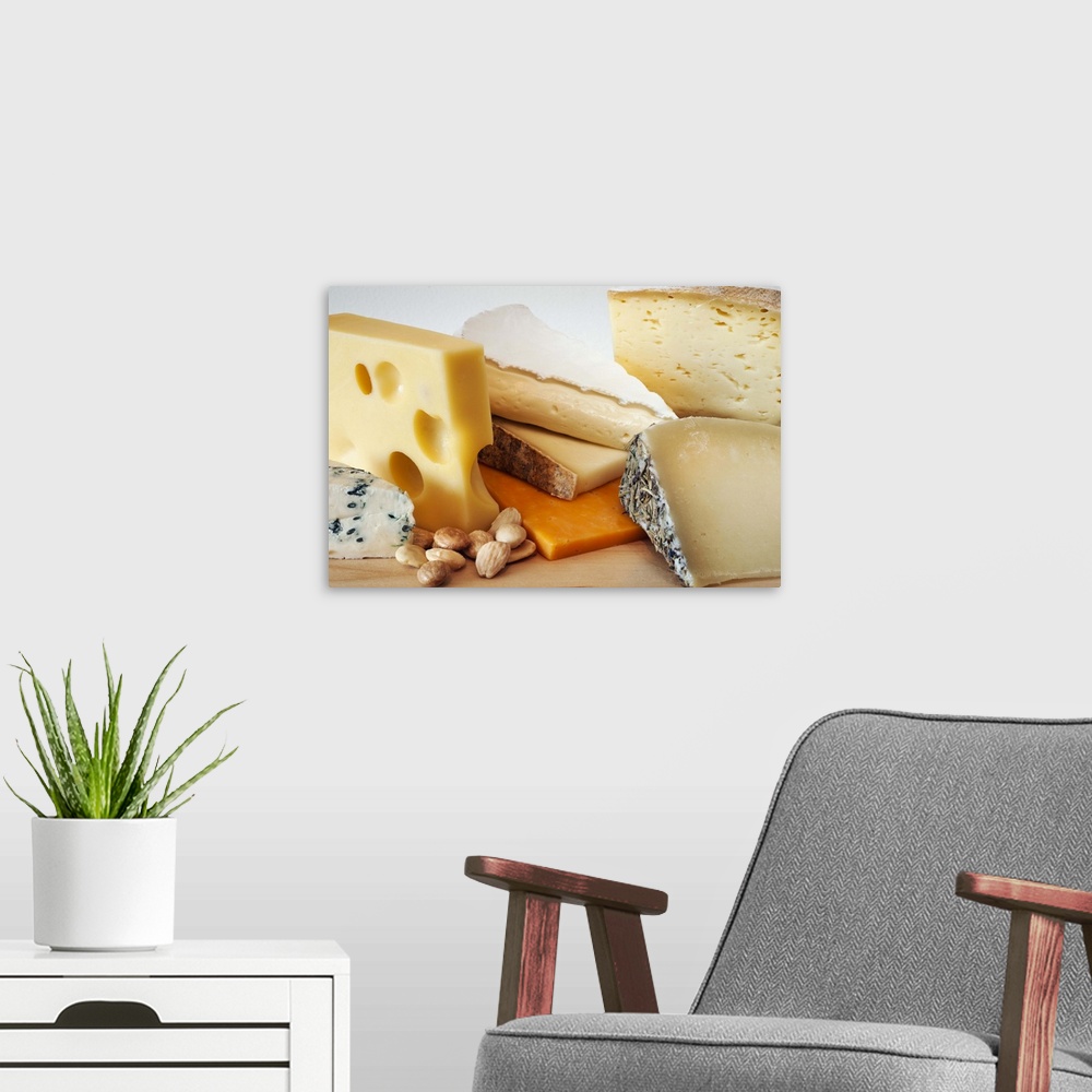 A modern room featuring Various cheeses on chopping board