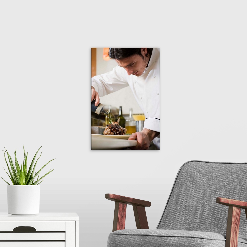 A modern room featuring Chef cooking in restaurant kitchen