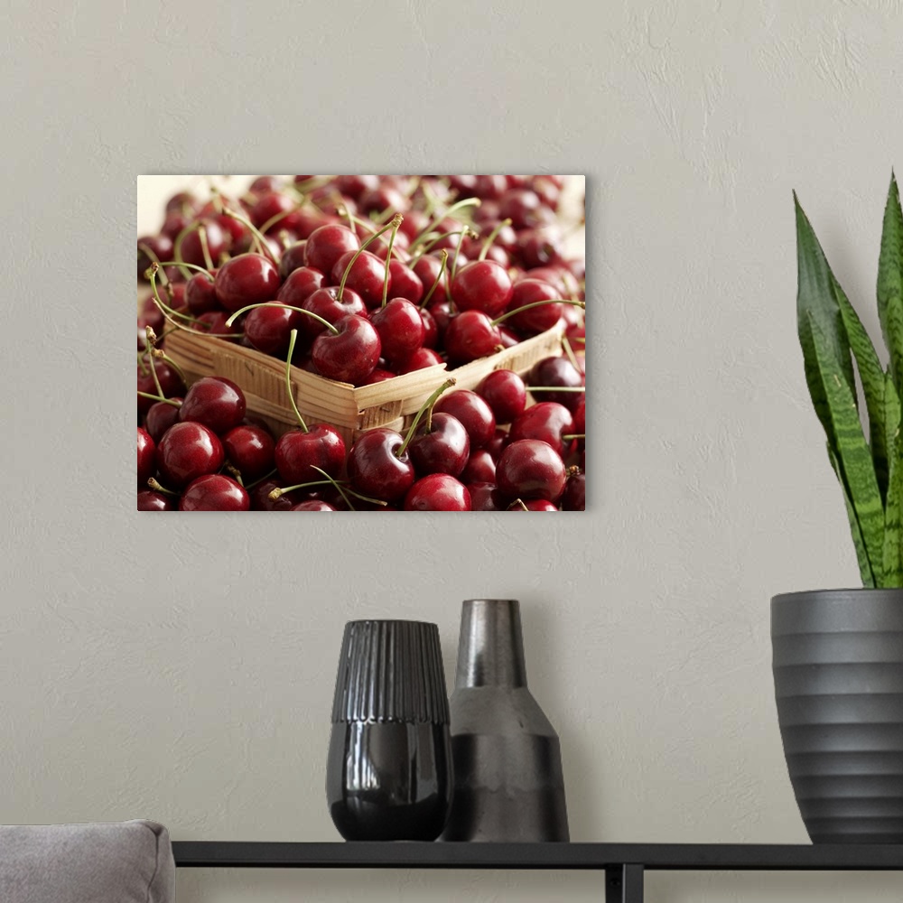 A modern room featuring Cherries in a basket