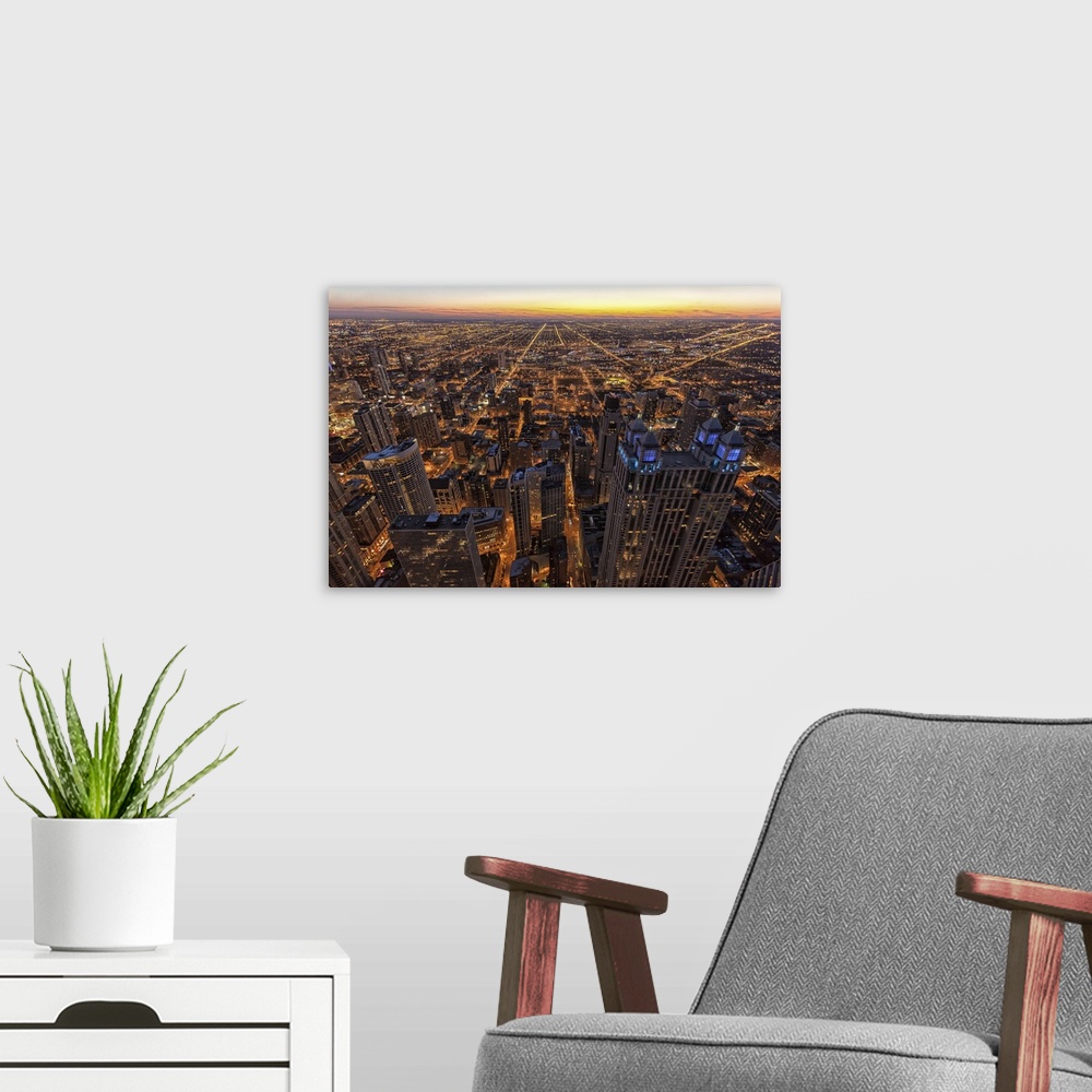 A modern room featuring Chicago downtown at sunset.