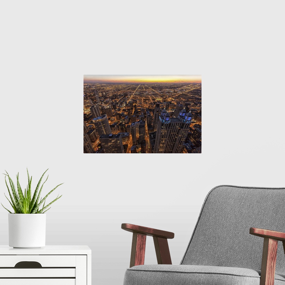 A modern room featuring Chicago downtown at sunset.