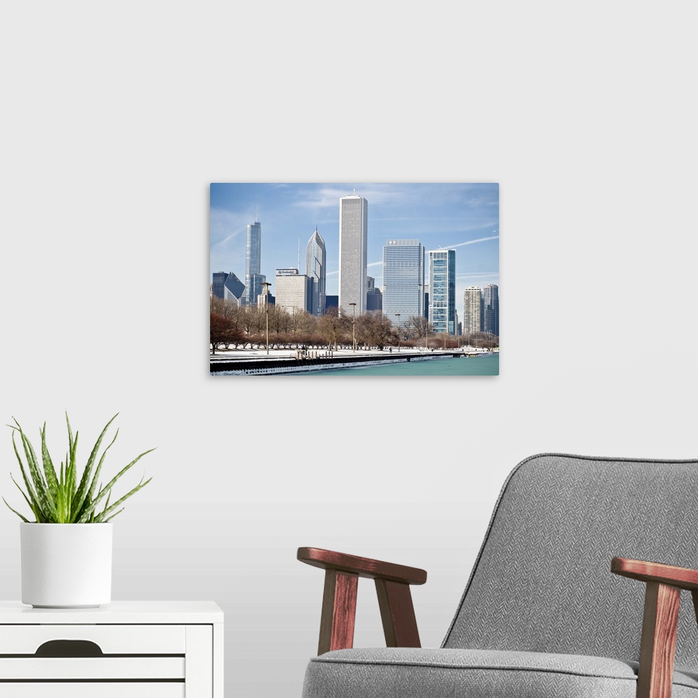 A modern room featuring Chicago skyline across frozen Lake Michigan.