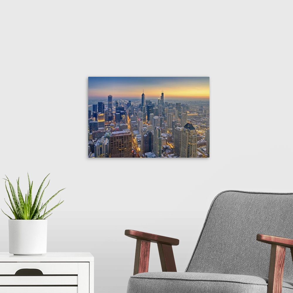 A modern room featuring Chicago skyline in blue hour.