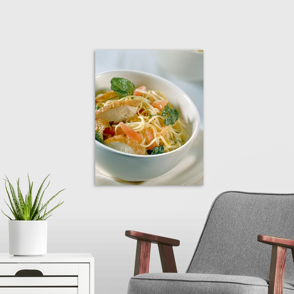 A modern room featuring Chicken pasta in bowl, close-up