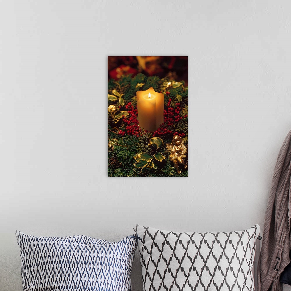 A bohemian room featuring Christmas candle with evergreen decorations