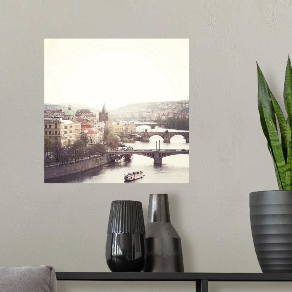 A modern room featuring City of Prague with bridges including Charles bridge crossing Vltava river.