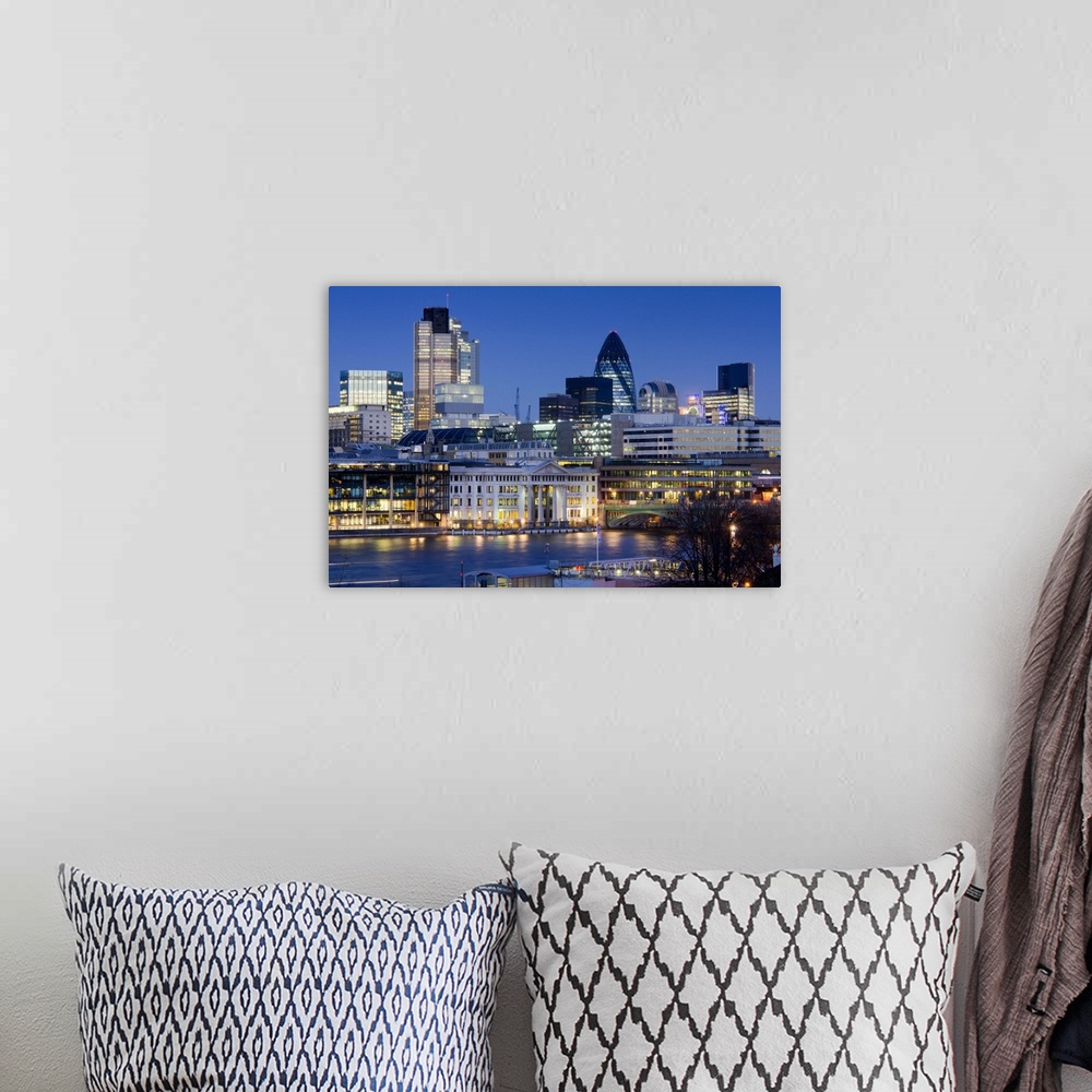 A bohemian room featuring Skyline across River Thames shows the City of London at twilight. Buildings include Heron Tower, ...
