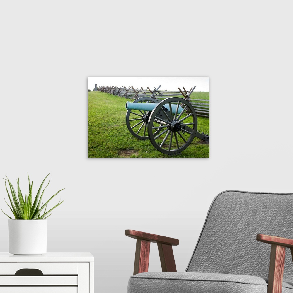 A modern room featuring USA, Pennsylvania, Gettysburg, US Army cannon and picket fence form part of Civil War Memorial at...