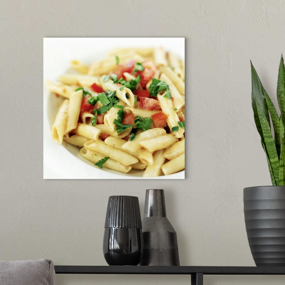 A modern room featuring close-up of a bowl of penne pasta