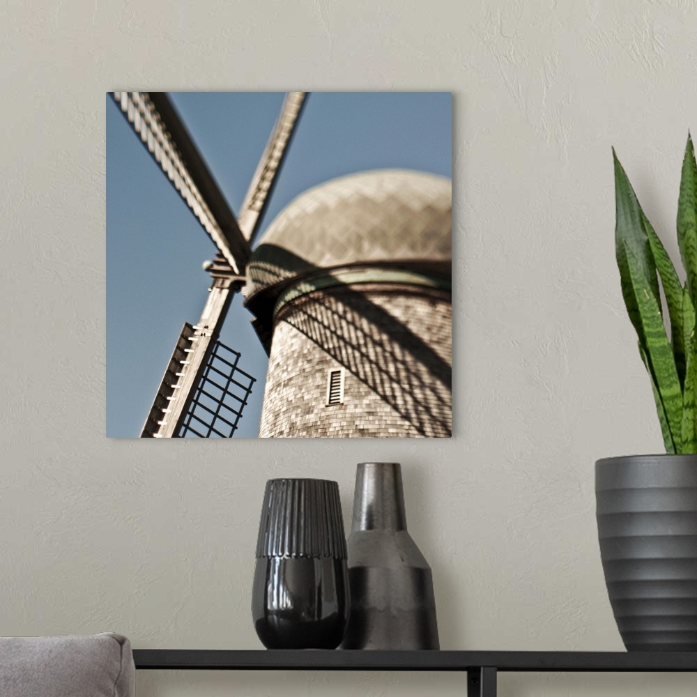 A modern room featuring close up of a Dutch windmill.