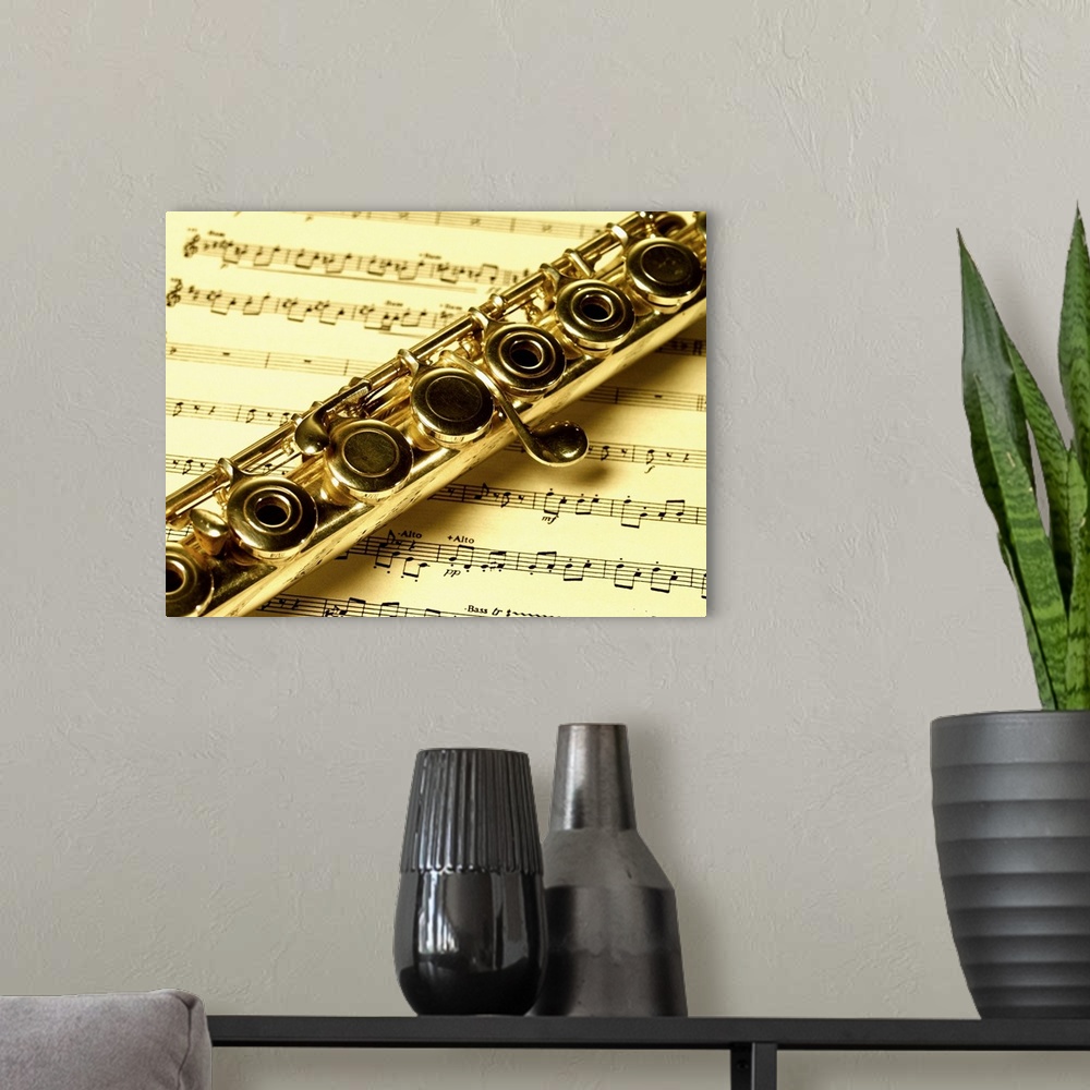 A modern room featuring Close-up of a flute on a sheet music