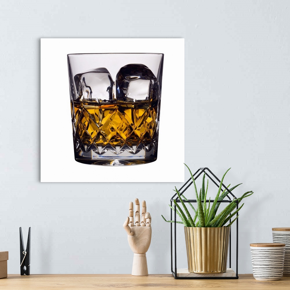 A bohemian room featuring Close up of a glass of whiskey and ice