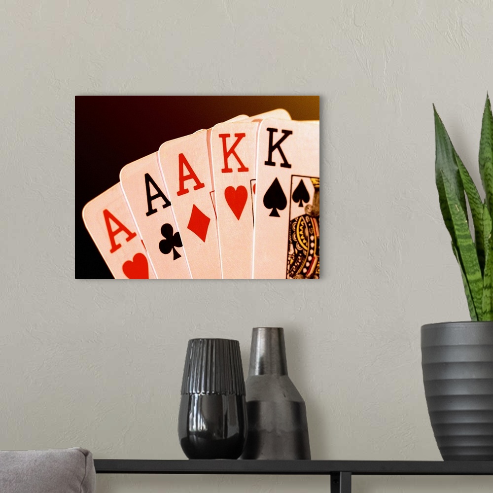 A modern room featuring Close-up of a hand of aces