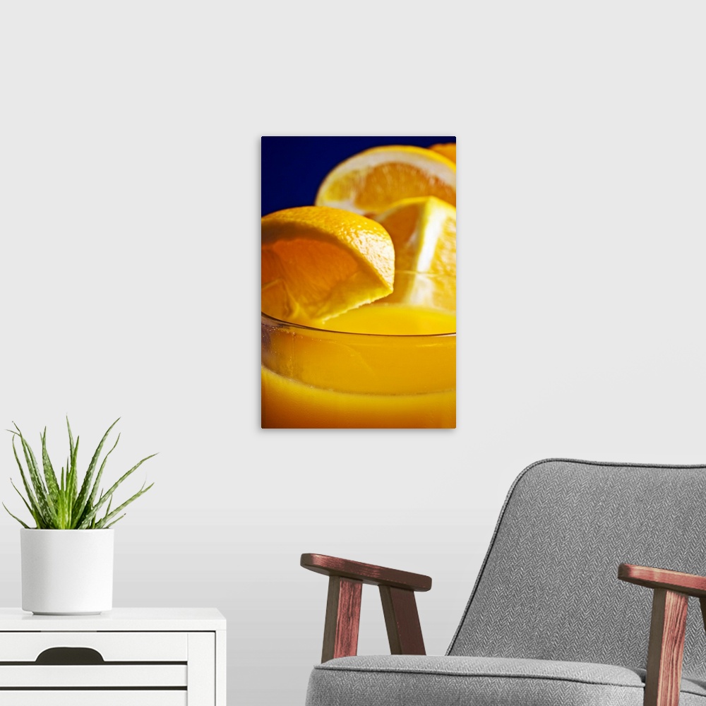 A modern room featuring Close-up of a refreshing glass of orange juice.