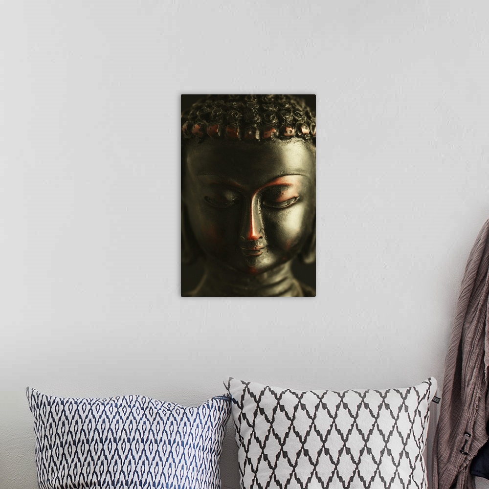 A bohemian room featuring Close-up of a statue of Buddha