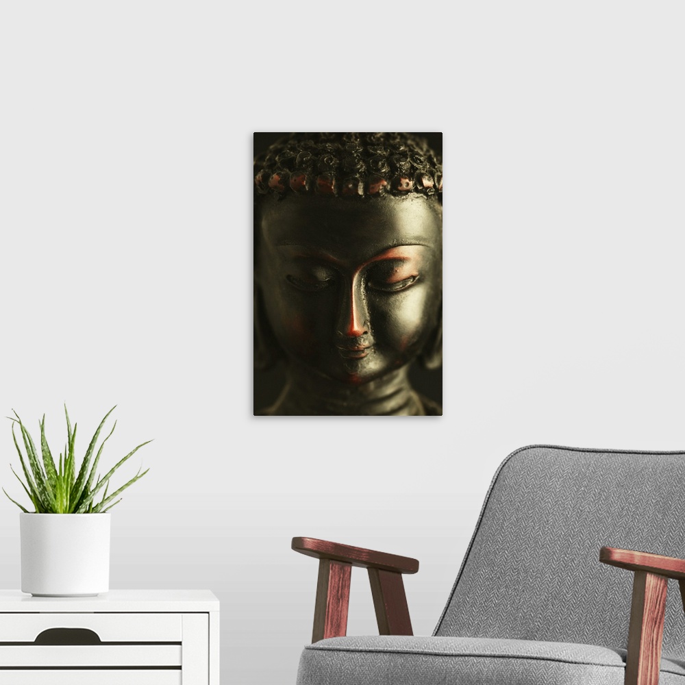 A modern room featuring Close-up of a statue of Buddha