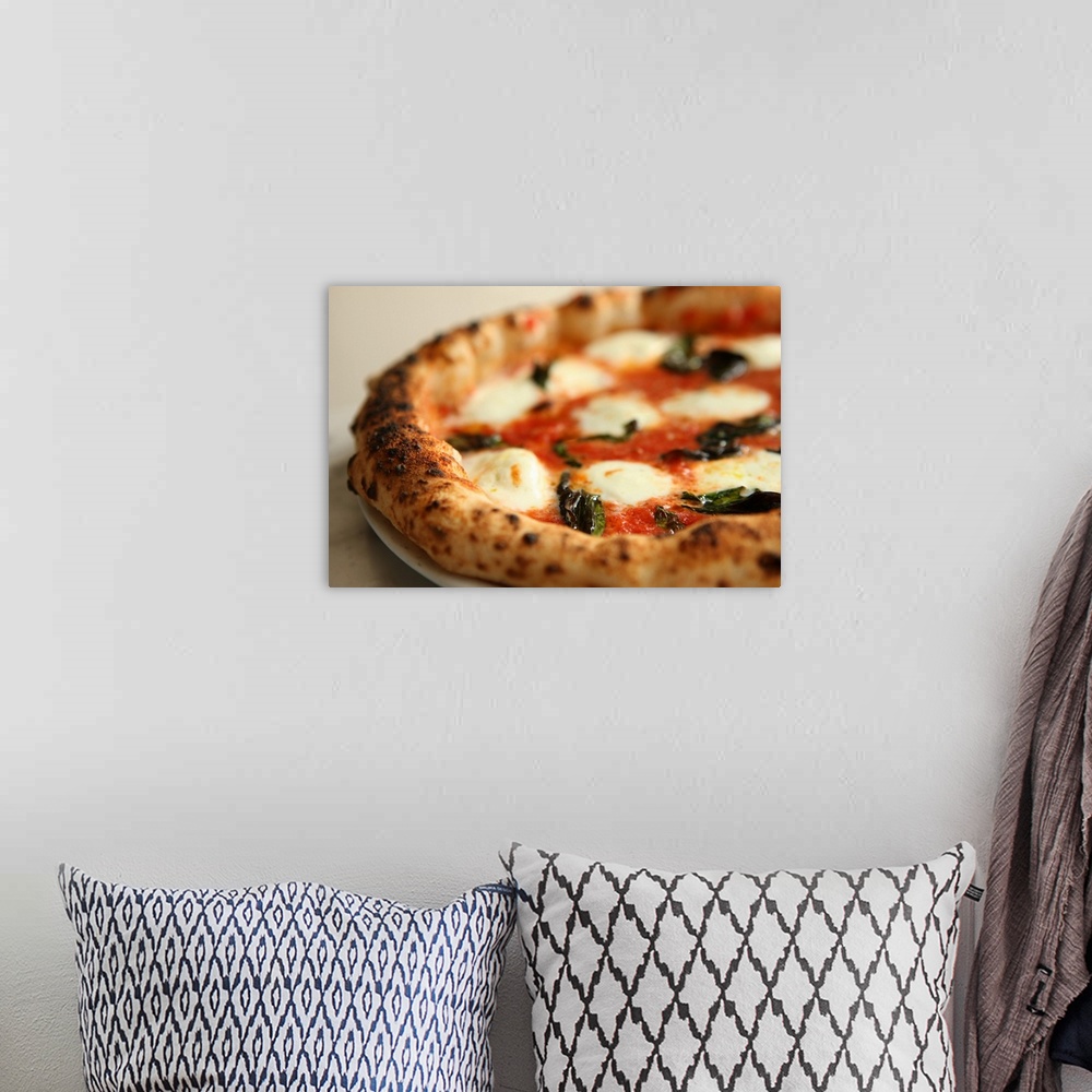 A bohemian room featuring Close-up of a whole pizza pie