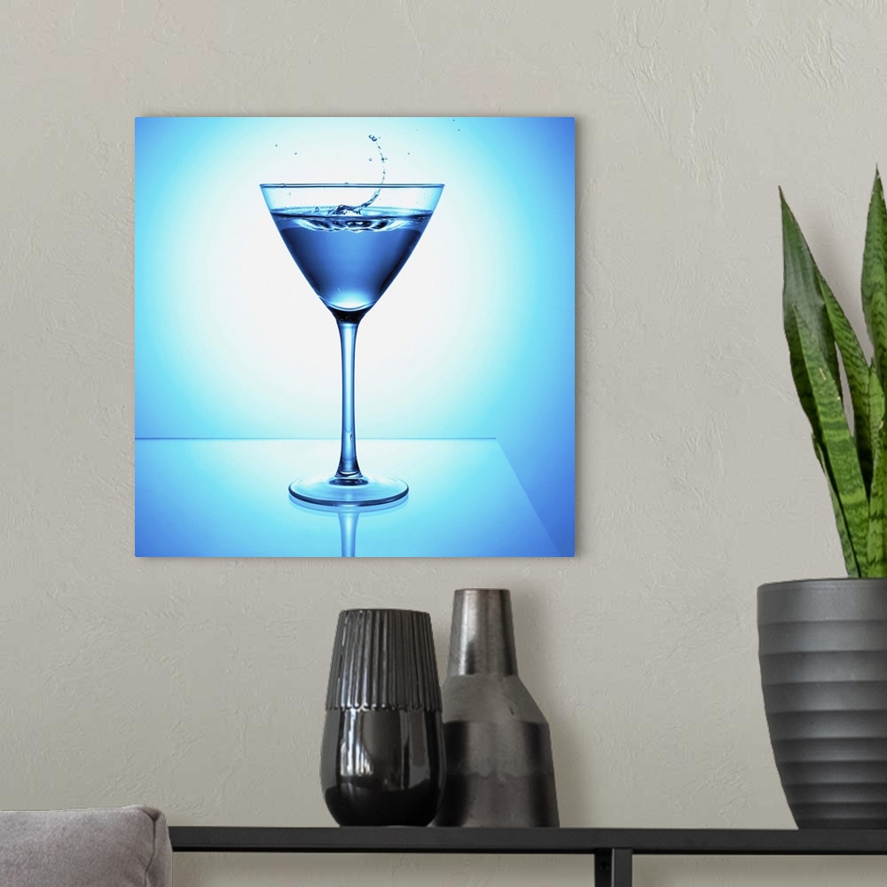 A modern room featuring Close up of blue martini cocktail