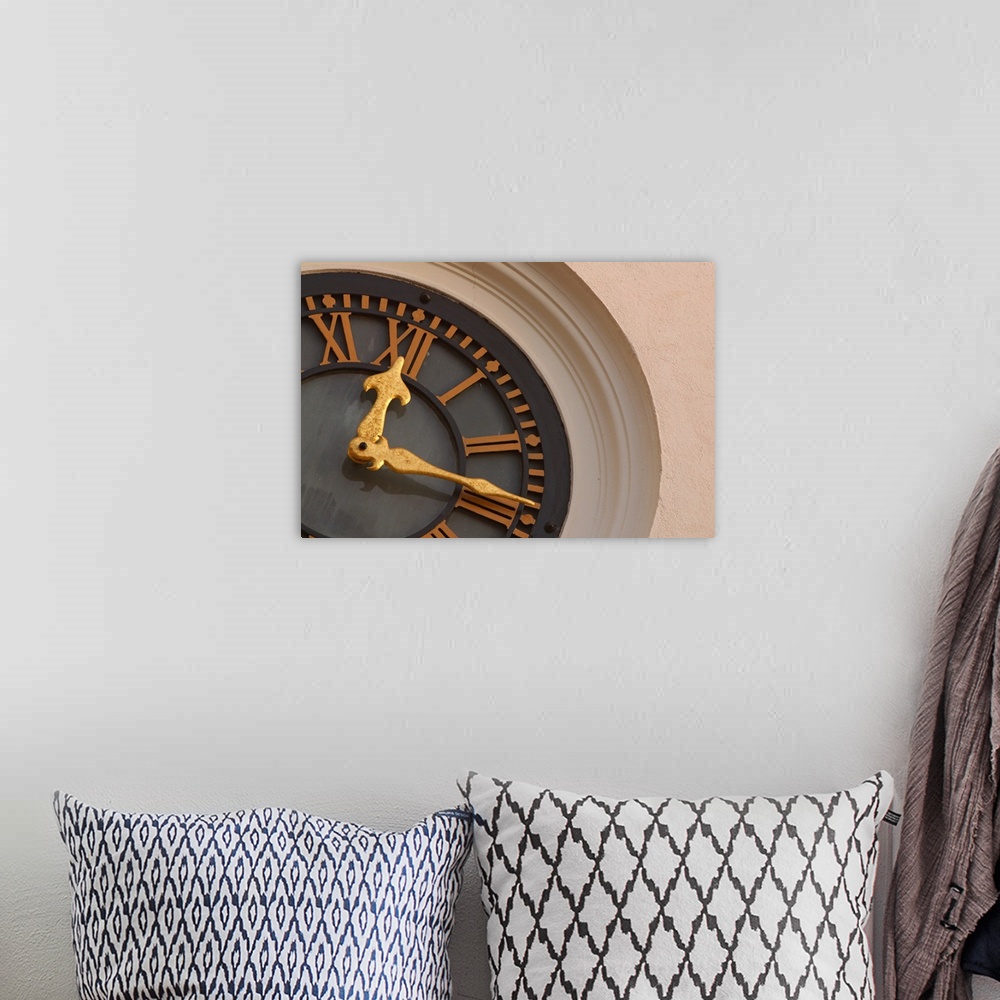 A bohemian room featuring Landscape, large, close up photograph of a partial clock on a tower.  The large golden hands of t...