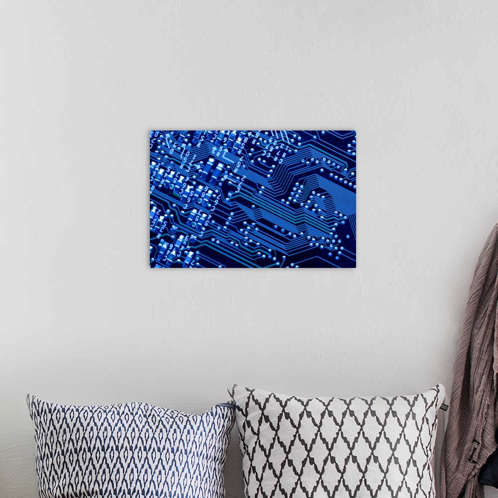 A bohemian room featuring Wall art of the up close view of a computer chip.