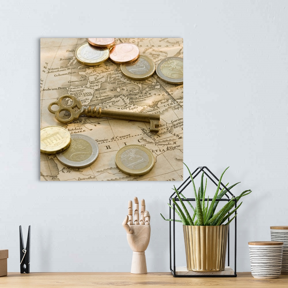 A bohemian room featuring Close up of euro coins, map and antique key