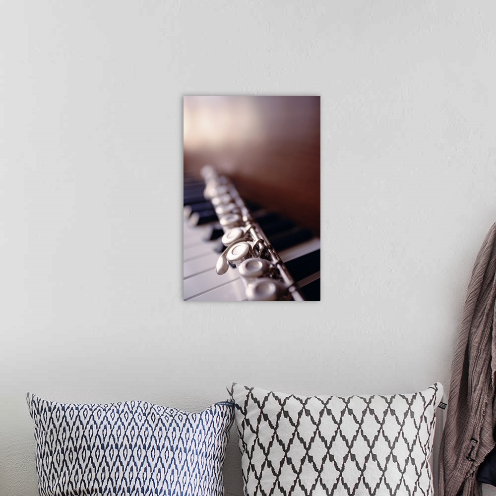 A bohemian room featuring Close-up of flute on piano keys