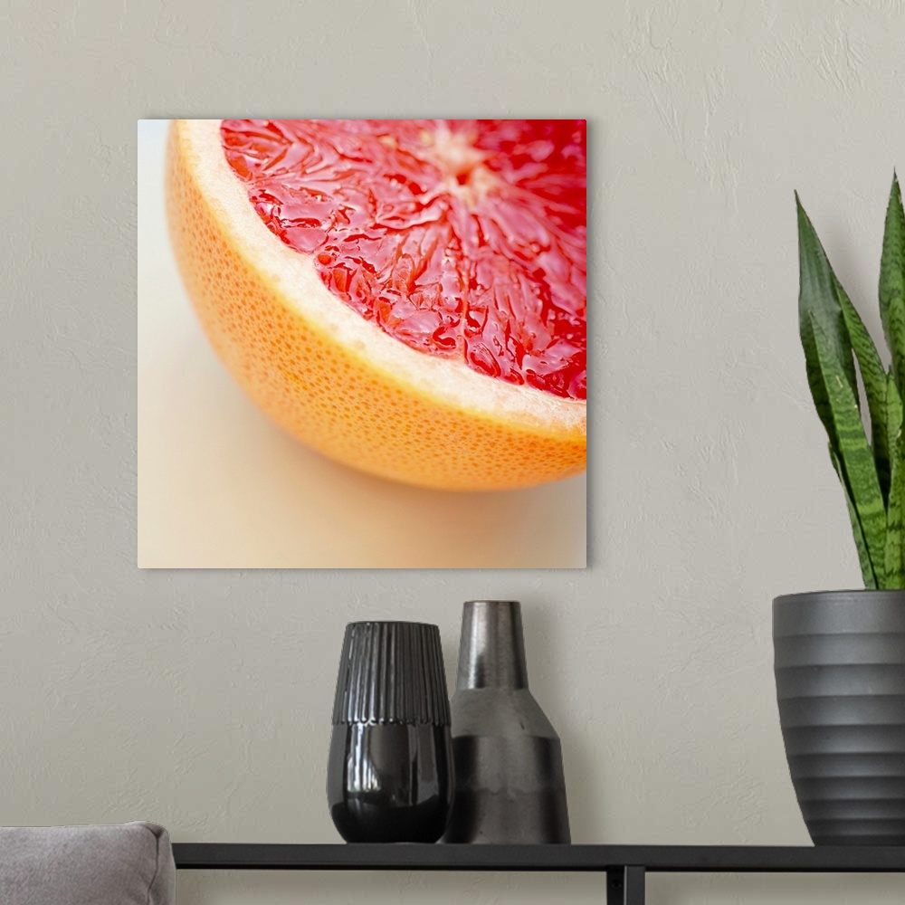 A modern room featuring Close up of halved pink grapefruit.