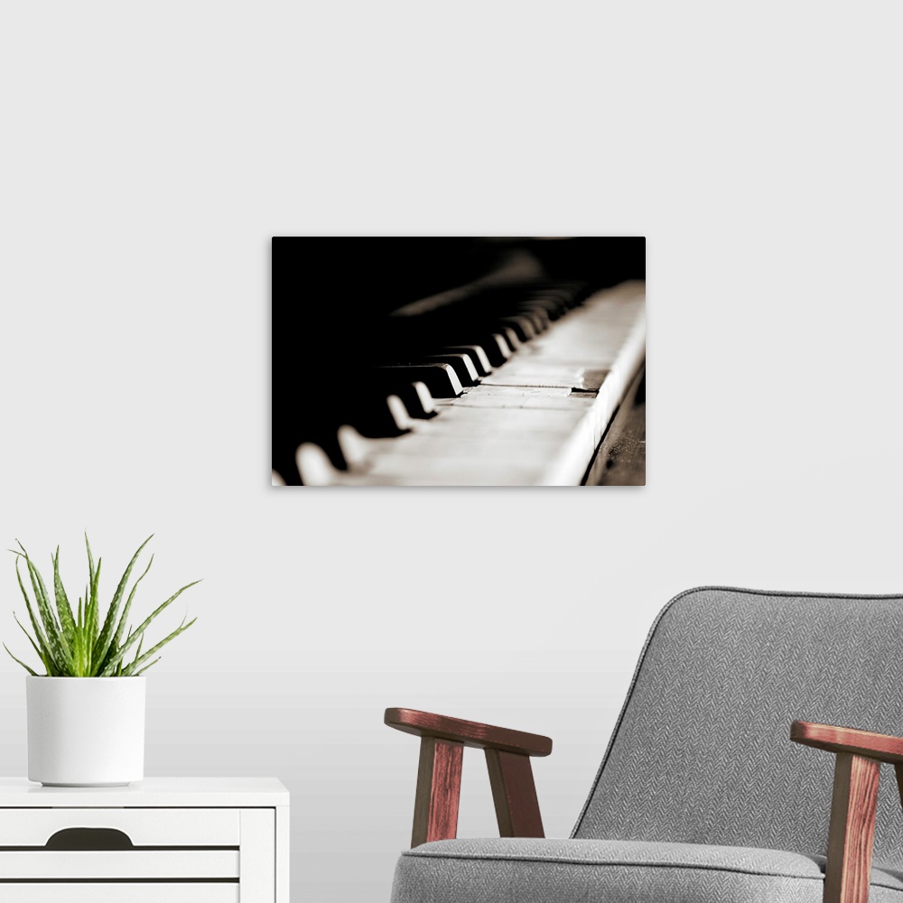 A modern room featuring Close up of keys of old piano.