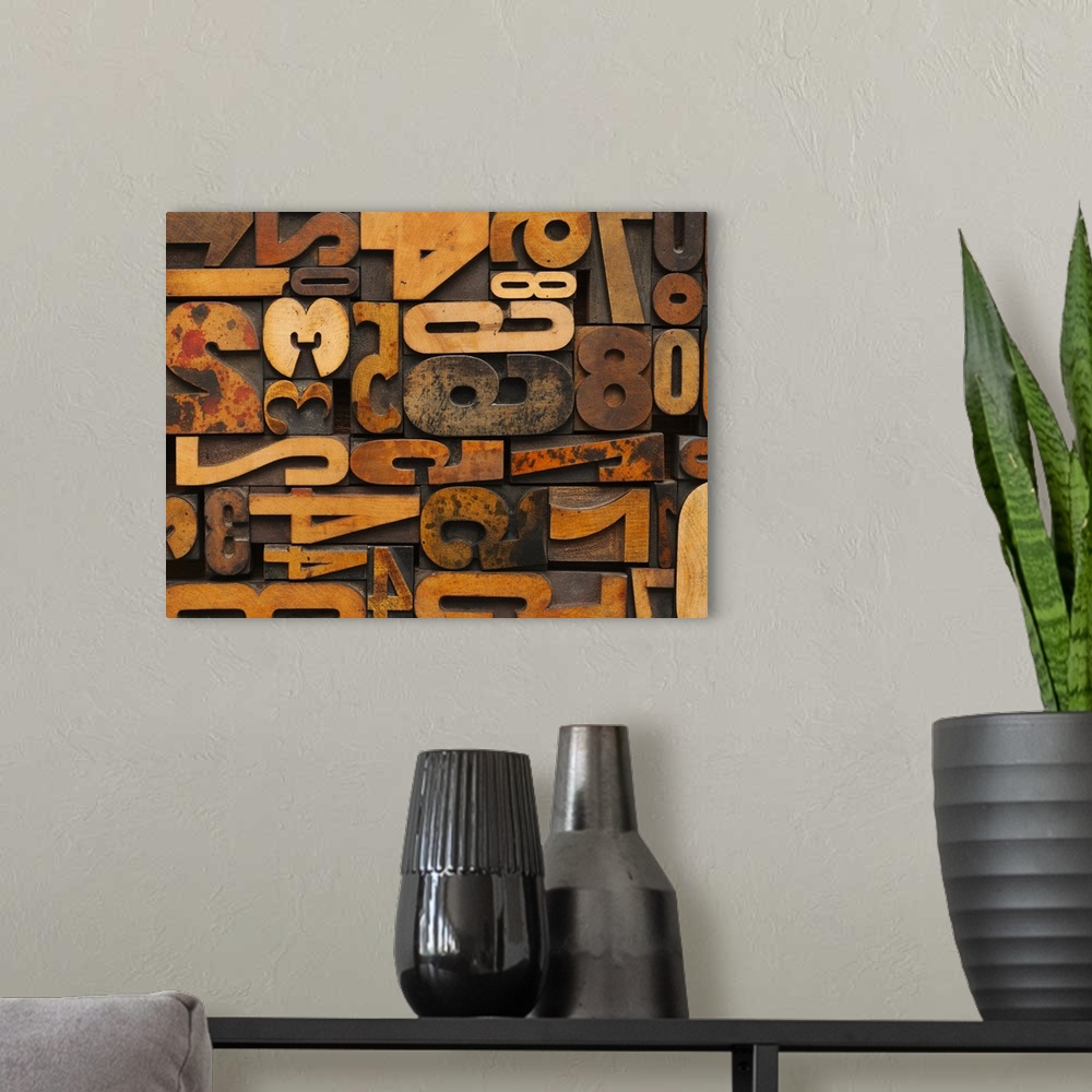 A modern room featuring Horizontal decorative wall art of wood block numbers arranged to fill the space.