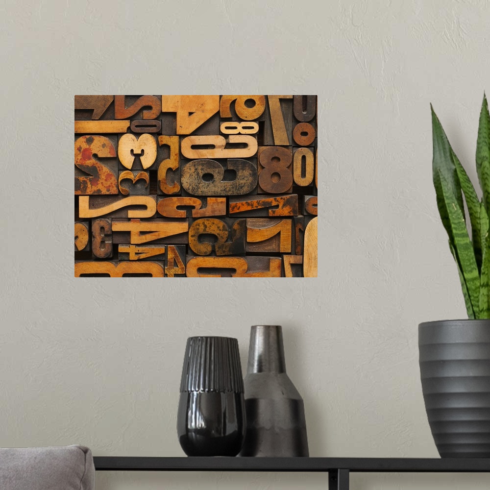 A modern room featuring Horizontal decorative wall art of wood block numbers arranged to fill the space.
