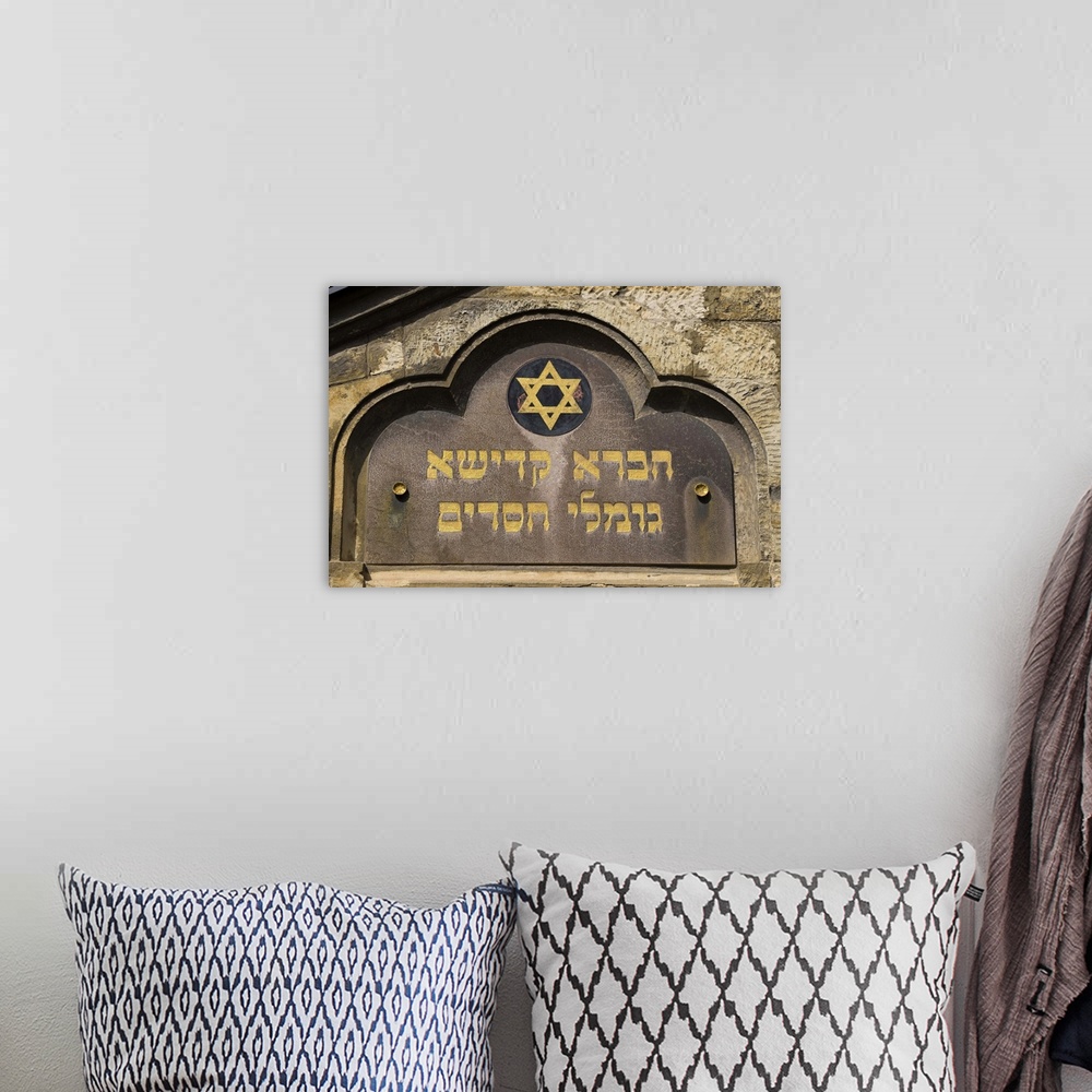 A bohemian room featuring Close up of old synagogue sign