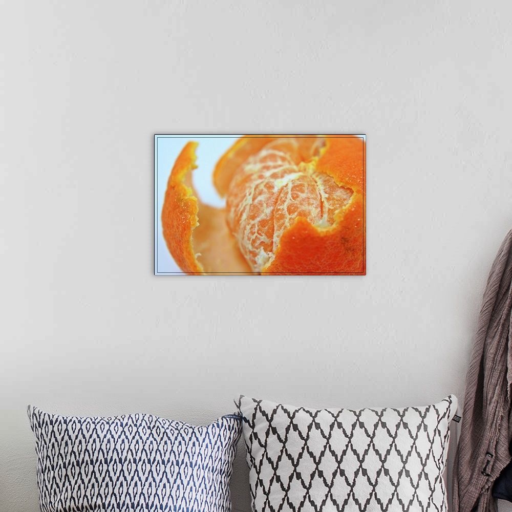 A bohemian room featuring Close up of partly peeled juicy orange.