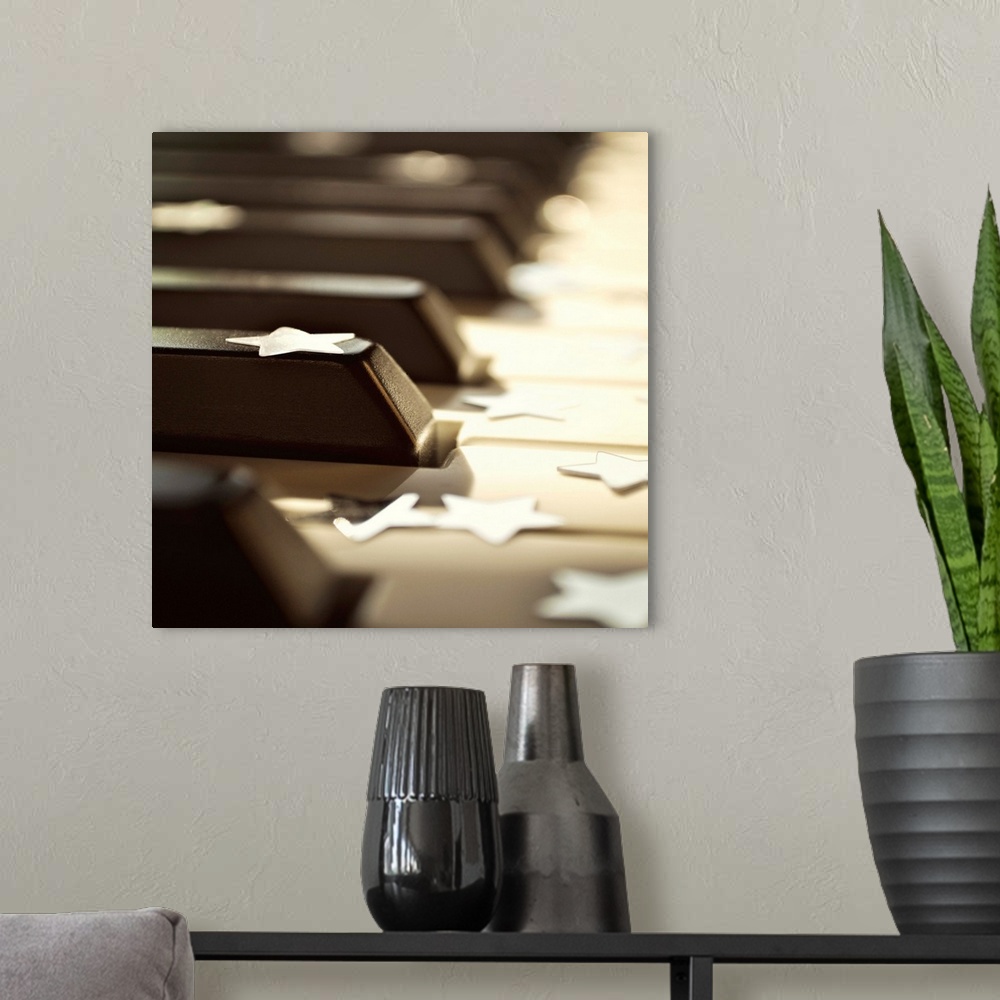 A modern room featuring Close up of piano keys with stars.