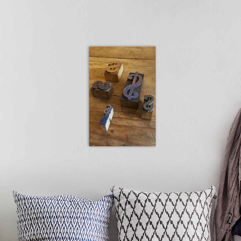 A bohemian room featuring Close up of printing blocks with dollar sign on wood