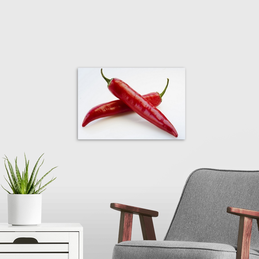 A modern room featuring Close up of red chili peppers on white background