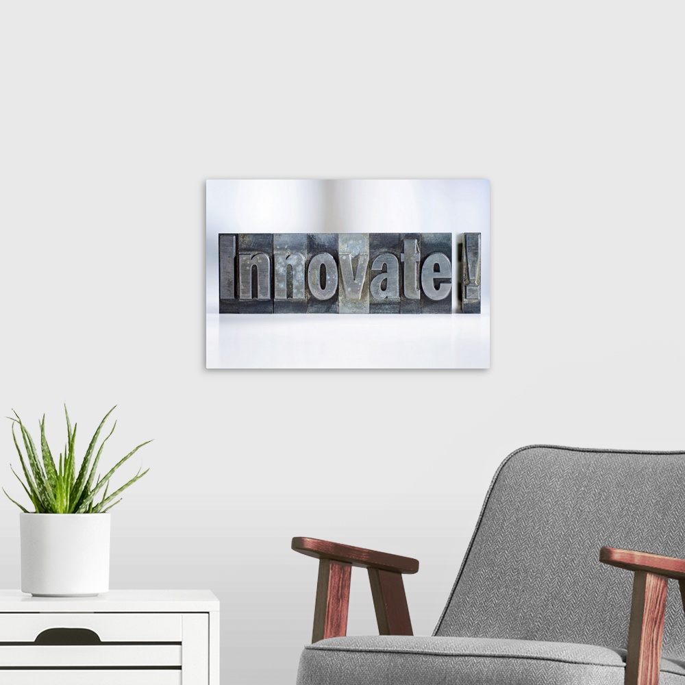 A modern room featuring Close up of single word made of printing blocks