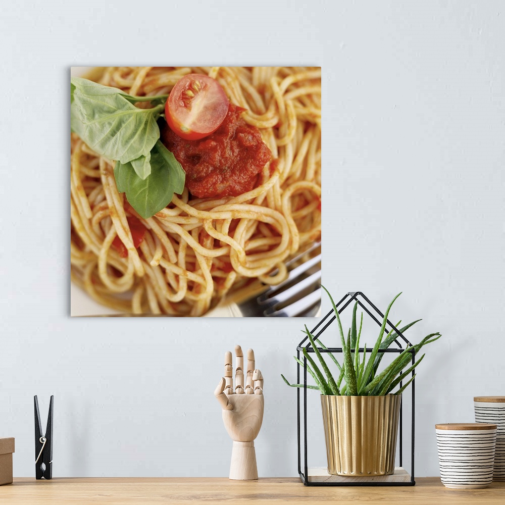 A bohemian room featuring close-up of spaghetti garnished with basil