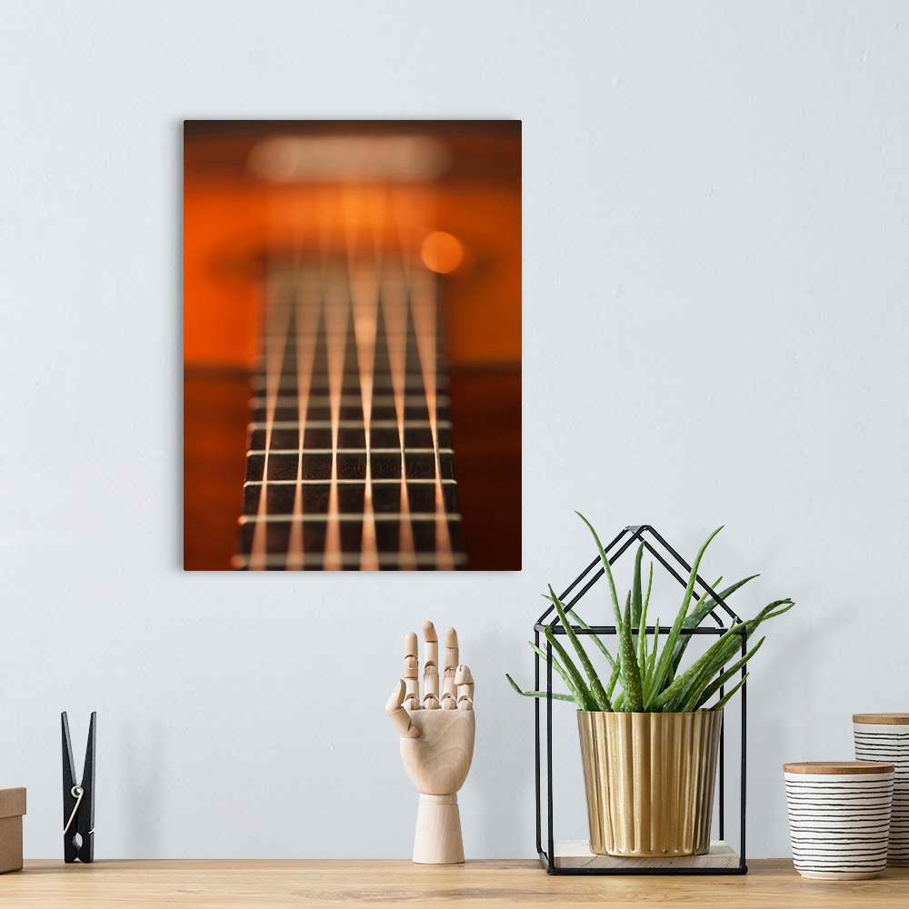 A bohemian room featuring Close up of strings of acoustic guitar