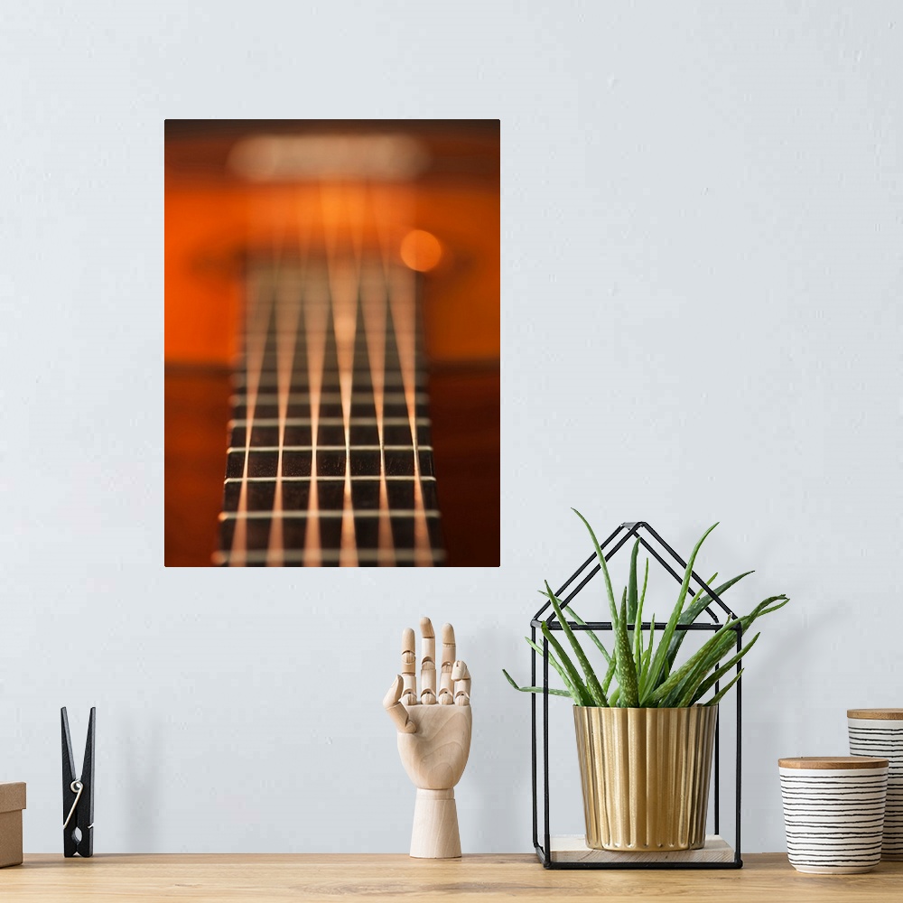 A bohemian room featuring Close up of strings of acoustic guitar