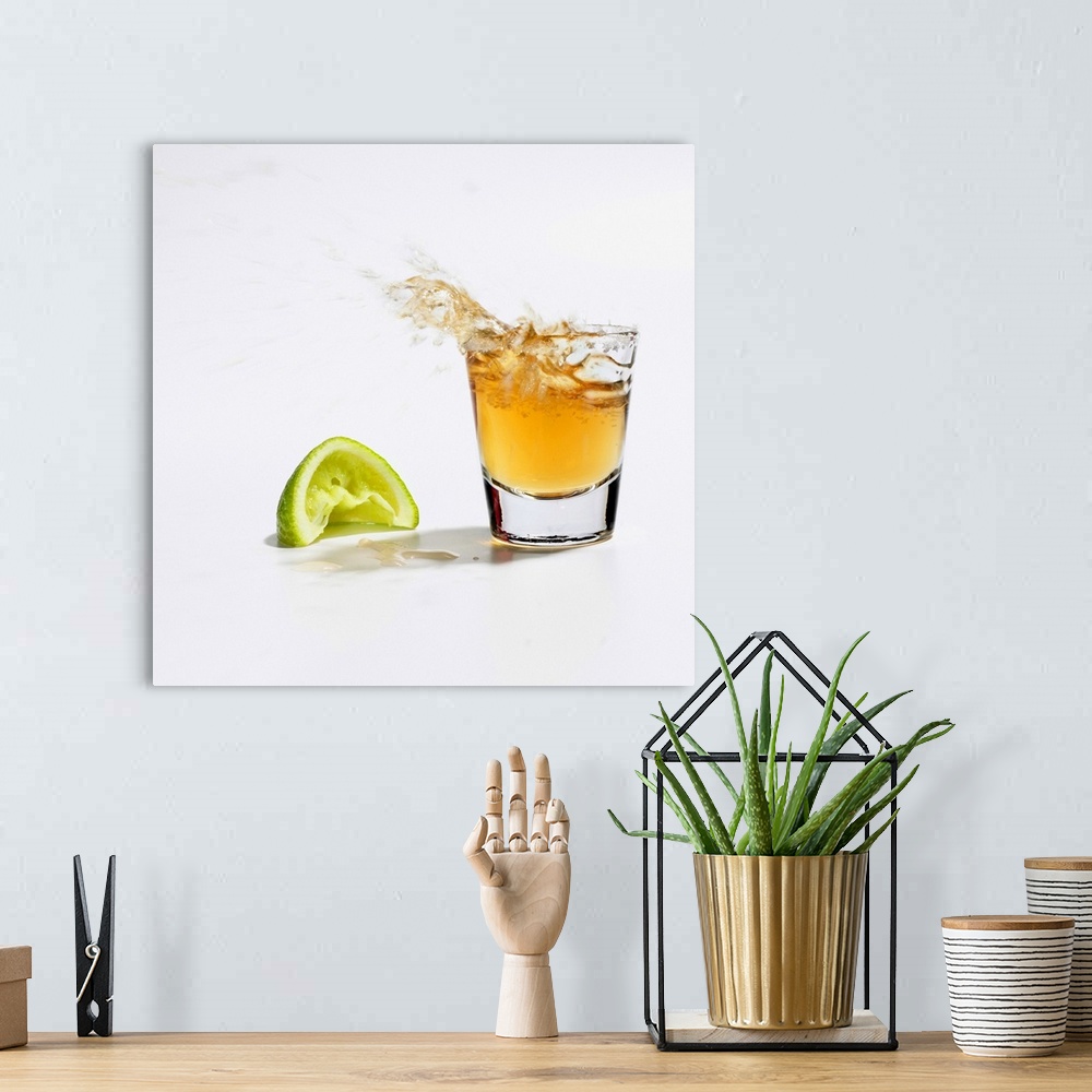 A bohemian room featuring Close up of tequila splashing out of glass