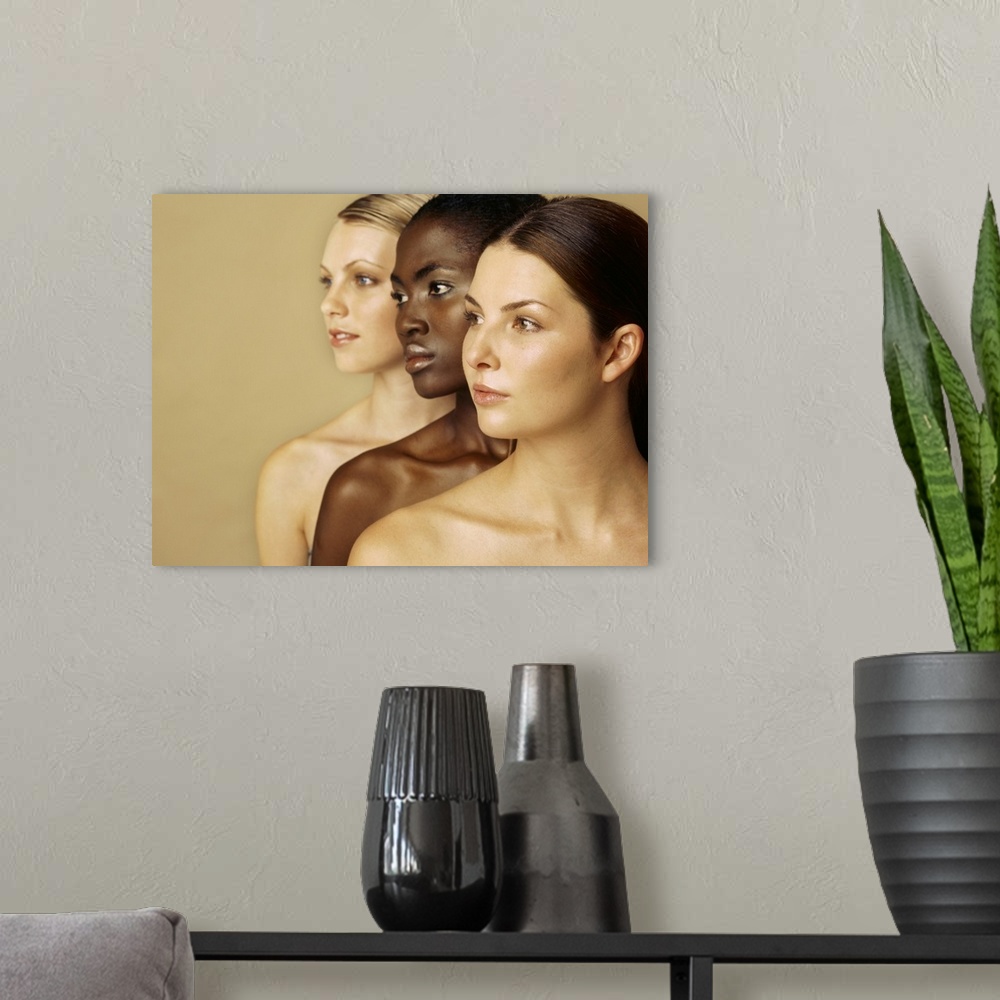 A modern room featuring Close-up of three young women looking away