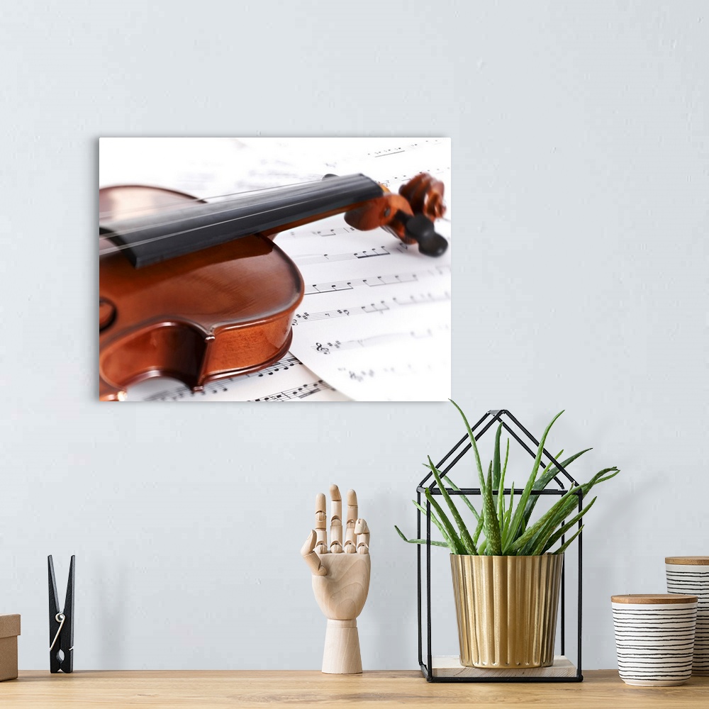 A bohemian room featuring Close up of violin and sheet music