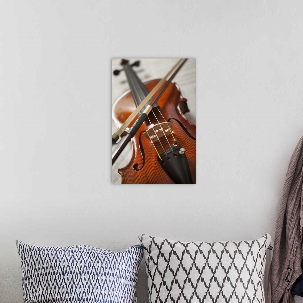 A bohemian room featuring Close-up of violin on sheet music